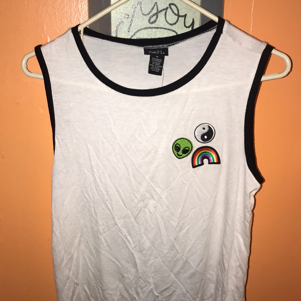 Super cute muscle tee with patches.